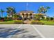 Elegant clubhouse with palm trees, offering a resort-style experience for residents at 9441 Discovery Ter # 101A, Bradenton, FL 34212