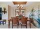 Dining room boasts tropical accents and a decorative chandelier at 9441 Discovery Ter # 101A, Bradenton, FL 34212