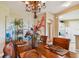 Dining room with beautiful chandelier and decor in neutral tones at 9441 Discovery Ter # 101A, Bradenton, FL 34212