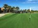 Expansive golf course with picturesque bridge, manicured green and clear blue sky, ideal for golf enthusiasts at 9441 Discovery Ter # 101A, Bradenton, FL 34212