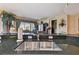 Kitchen featuring dark countertops, white cabinetry, a stainless steel sink, and scenic backyard views at 9441 Discovery Ter # 101A, Bradenton, FL 34212