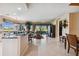 Open floor plan featuring kitchen island and spacious living room with golf course views at 9441 Discovery Ter # 101A, Bradenton, FL 34212