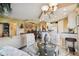Open concept living space with kitchen, dining, and living area in neutral tones at 9441 Discovery Ter # 101A, Bradenton, FL 34212