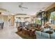 Inviting living room showcases an open layout, comfortable seating, and natural light, adjacent to kitchen at 9441 Discovery Ter # 101A, Bradenton, FL 34212
