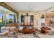 Spacious living room featuring plush seating, elegant decor, and seamless access to the outdoor views at 9441 Discovery Ter # 101A, Bradenton, FL 34212
