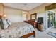 Cozy main bedroom with private access to the backyard, an ensuite bathroom, and ample space at 9441 Discovery Ter # 101A, Bradenton, FL 34212