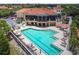 Community pool with lounge seating, and covered patio area at 9441 Discovery Ter # 101A, Bradenton, FL 34212