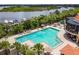 Relaxing pool area surrounded by lounge chairs and lush greenery at 9441 Discovery Ter # 101A, Bradenton, FL 34212