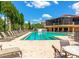Inviting community pool featuring ample lounge seating, shaded areas, and a relaxing atmosphere at 9441 Discovery Ter # 101A, Bradenton, FL 34212