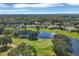 An aerial view shows the surrounding golf course and lakes at 9612 Old Hyde Park Pl, Bradenton, FL 34202