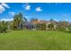 Beautiful backyard features a screened pool and patio at 9612 Old Hyde Park Pl, Bradenton, FL 34202