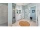 Bathroom featuring a walk-in shower with glass door, white vanity and neutral wall color at 9612 Old Hyde Park Pl, Bradenton, FL 34202