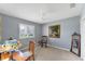 Cozy bedroom with a window, ceiling fan, and a classic painting at 9612 Old Hyde Park Pl, Bradenton, FL 34202