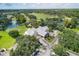Overhead view of golf clubhouse and surrounding course highlighting the well-maintained landscaping and parking at 9612 Old Hyde Park Pl, Bradenton, FL 34202