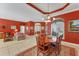 Open-concept living and dining area with a seamless flow, tile flooring, and a bright, airy feel at 9612 Old Hyde Park Pl, Bradenton, FL 34202