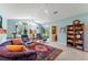 Bright living room with comfortable seating and lots of natural light from large windows at 9612 Old Hyde Park Pl, Bradenton, FL 34202