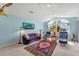 Open living room featuring lots of light, vaulted ceilings, and comfortable furnishings at 9612 Old Hyde Park Pl, Bradenton, FL 34202