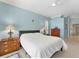 Main bedroom with a ceiling fan and an en-suite bathroom at 9612 Old Hyde Park Pl, Bradenton, FL 34202