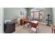 Home office featuring plenty of natural light and dark wood furniture at 9612 Old Hyde Park Pl, Bradenton, FL 34202