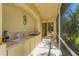 Outdoor kitchen with sink and grill at 9612 Old Hyde Park Pl, Bradenton, FL 34202