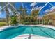 Relax in this screened pool with an attached spa at 9612 Old Hyde Park Pl, Bradenton, FL 34202