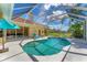 Enjoy the outdoors in this screened-in pool and patio overlooking water and golf views at 9612 Old Hyde Park Pl, Bradenton, FL 34202