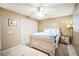 Cozy bedroom featuring a white wooden bed frame, closet, and tile flooring at 1000 Riverside Dr # B102, Palmetto, FL 34221