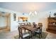 Cozy dining area with seating for six, adjacent to kitchen, and views of the living space at 1000 Riverside Dr # B102, Palmetto, FL 34221