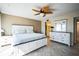 Comfortable main bedroom with large bed, ceiling fan, and ensuite bathroom access at 1000 Riverside Dr # B102, Palmetto, FL 34221
