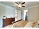 Bedroom featuring a wood dresser and access to a bathroom and walkway, offering convenient layout at 11511 Harbourside Ln, Parrish, FL 34219