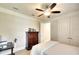 Bedroom with light-colored walls and flooring, featuring a dresser and closet, offering ample storage at 11511 Harbourside Ln, Parrish, FL 34219