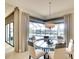 Cozy breakfast nook features water views and a modern chandelier at 11511 Harbourside Ln, Parrish, FL 34219