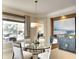 Bright dining area features water views and custom furniture at 11511 Harbourside Ln, Parrish, FL 34219