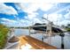 Private boat dock with boat lift, providing direct water access and convenience for boating enthusiasts at 11511 Harbourside Ln, Parrish, FL 34219