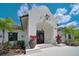 Stunning home features a unique architectural design, lush landscaping and a welcoming double door entrance at 11511 Harbourside Ln, Parrish, FL 34219
