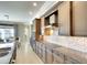 Gourmet kitchen boasts stainless steel appliances, granite countertops, and custom cabinets at 11511 Harbourside Ln, Parrish, FL 34219
