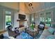 Inviting living room with a cozy fireplace, comfortable seating, and stylish decor, ideal for relaxation at 11511 Harbourside Ln, Parrish, FL 34219