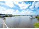 Serene waterfront view featuring private docks, showcasing the tranquil beauty of the waterfront property at 11511 Harbourside Ln, Parrish, FL 34219