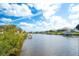 Scenic waterfront view showing serene canal with docks and well-maintained homes in a desirable neighborhood at 11511 Harbourside Ln, Parrish, FL 34219
