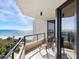 Balcony with seating offering views of the ocean, beach, and coastal landscape at 1211 Gulf Of Mexico Dr # 702, Longboat Key, FL 34228