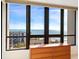 Bright bedroom featuring a wooden dresser under a large window displaying fantastic views at 1211 Gulf Of Mexico Dr # 702, Longboat Key, FL 34228