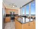 Modern kitchen with granite countertops, stainless steel appliances, and plenty of storage at 1211 Gulf Of Mexico Dr # 702, Longboat Key, FL 34228