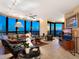 Inviting living room boasts floor to ceiling windows with spectacular ocean views and comfortable seating at 1211 Gulf Of Mexico Dr # 702, Longboat Key, FL 34228