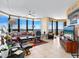 Spacious living area features tile flooring, ample seating, and stunning panoramic ocean views at 1211 Gulf Of Mexico Dr # 702, Longboat Key, FL 34228