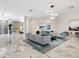 This grand lobby has marble floors, modern lighting, and comfortable seating at 1211 Gulf Of Mexico Dr # 702, Longboat Key, FL 34228