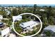 Serene coastal home surrounded by lush greenery, mature trees and the open water in a picturesque setting at 123 Hammock Rd, Anna Maria, FL 34216