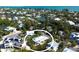 Coastal home nestled among mature trees, offering privacy and a serene environment near the water at 123 Hammock Rd, Anna Maria, FL 34216