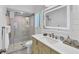 Modern bathroom features a glass shower, white vanity, and sleek fixtures for a spa-like experience at 123 Hammock Rd, Anna Maria, FL 34216
