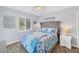 Cozy bedroom features serene decor, comfortable furnishings, and ample natural light at 123 Hammock Rd, Anna Maria, FL 34216