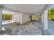 Spacious garage with ample parking and storage space with additional outdoor covered space at 123 Hammock Rd, Anna Maria, FL 34216